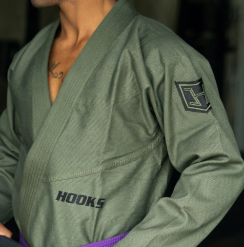 Brazilian Jiu-Jitsu (BJJ) is a martial art sport that is focused on grappling and ground fighting techniques. The BJJ gi, also known as a kimono, is the traditional uniform worn by practitioners during training and competitions. In Brazilian Jiu-Jitsu, the belt system consists of various colors starting with white for beginners and progressing through blue, purple, brown, and black belts, with degrees of black belt denoted by stripes. Gis are typically made of cotton or a cotton-polyester blend. The weight and weave of the fabric can vary, affecting the durability and feel of the gi. Hooks Jiujitsu BJJ gis is the perfect combination of style and performance for any Brazilian Jiu-Jitsu practitioner. Our Brazilian Jiu Jitsu Gi comes in a huge variety of styles and colors. A BJJ Gi is a uniform that you wear once you train in Brazilian Jiu Jitsu. Our Gi will assist you to improve your abilities in addition to saving you from injuries. The BJJ Gi is typically a slimmer fit than a judo Gi. We have a huge range of Jiu-Jitsu and MMA equipment available. Shop today! Visit https://hooksbrand.com/collections/bjj-gis